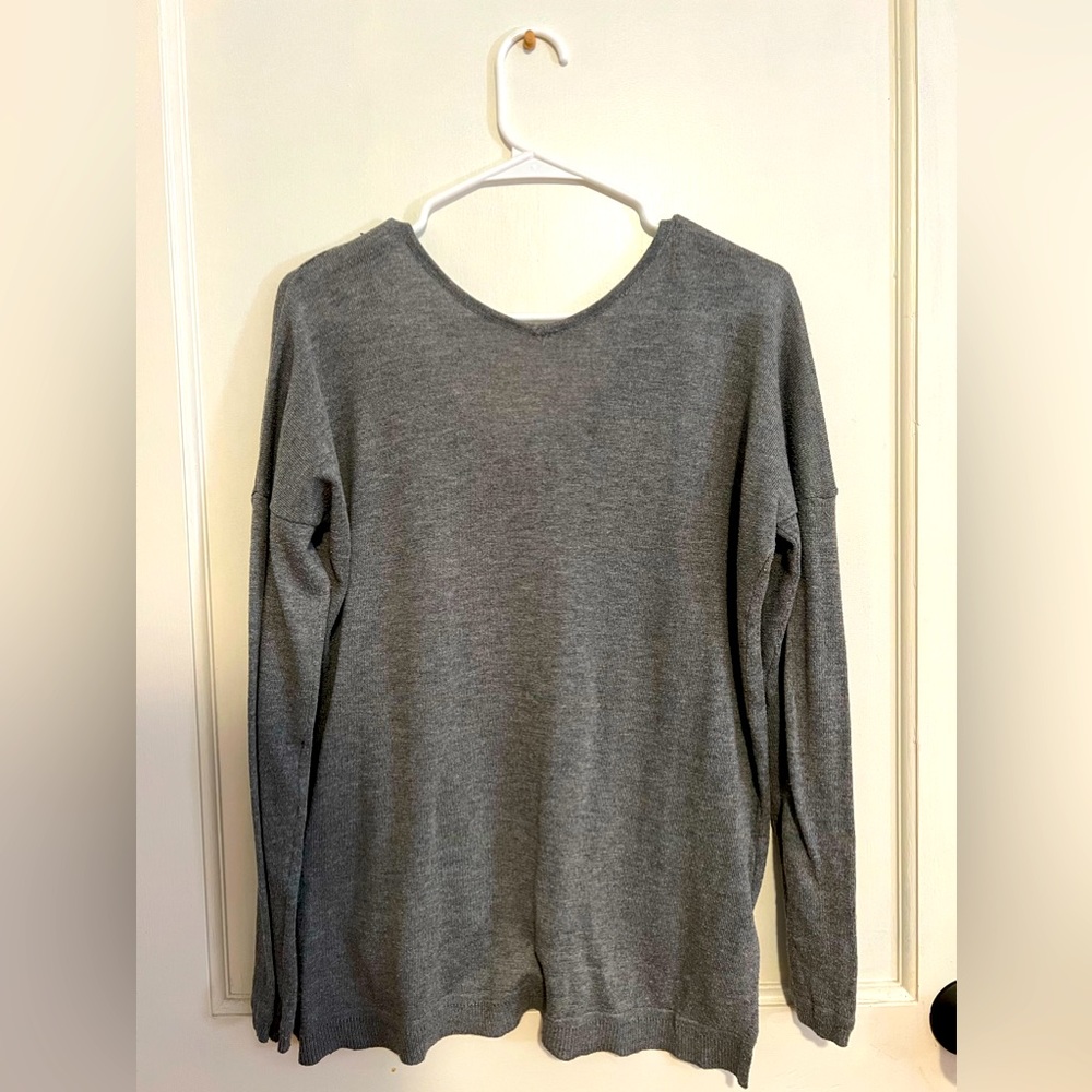 Gray, loose fitting sweater. Never worn.